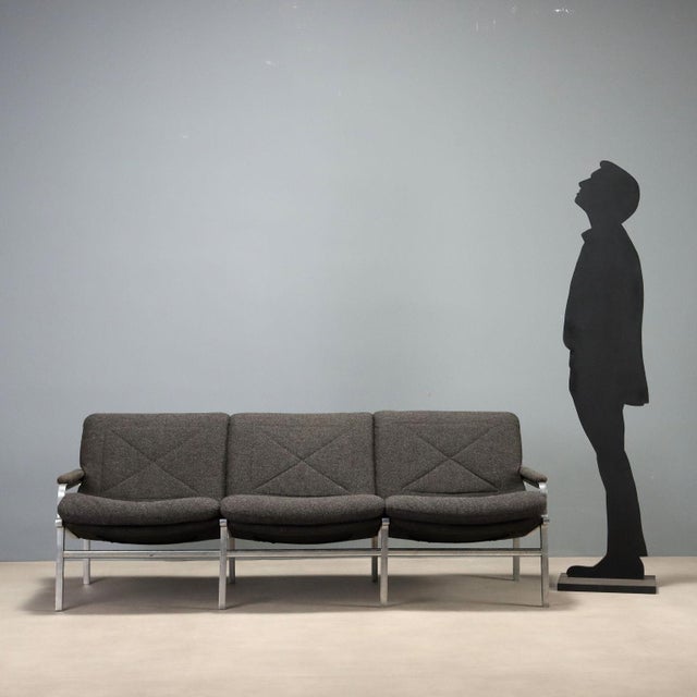 Vintage mid-century modern three-seater sofa, designed by André Vandenbeuck and produced by Strässle International. The...