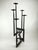An impressive, sculptural floor candlestick in the brutalist style of its time. It is made of hand-forged, blackened iron...