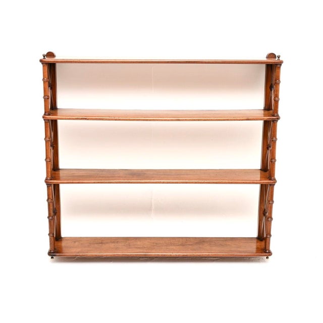 A gorgeous antique Georgian period walnut wall mounting bookcase. This was made in England, we would date it from around...