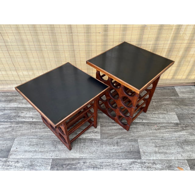 A pair of Vintage Handcrafted mid-century modern wine racks /Side tables. Circa 1960s Features two different-height solid-...