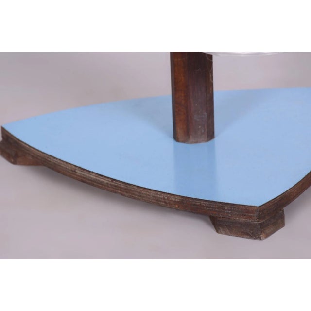 This Mid-Century flower stand from the mid-20th century was crafted in Czechoslovakia. Made from beech wood, Formica, and...