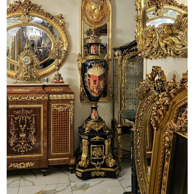 Make a dramatic statement with this breathtaking monumental Sevres-style porcelain vase on pedestal, a luxurious piece...
