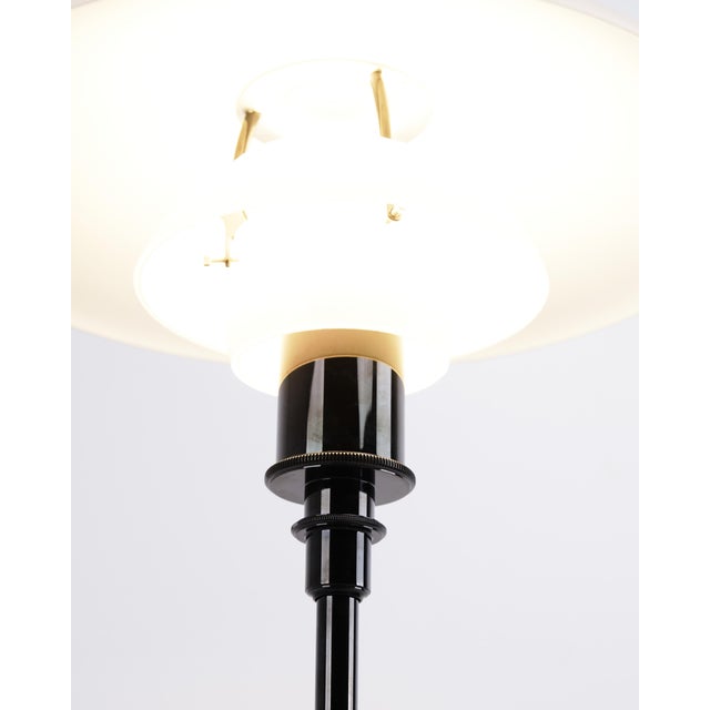 Ph 3.5/2.5 floor lamp designed by poul henningsen and produced by louis poulsen. The lamp is made with a black frame and...
