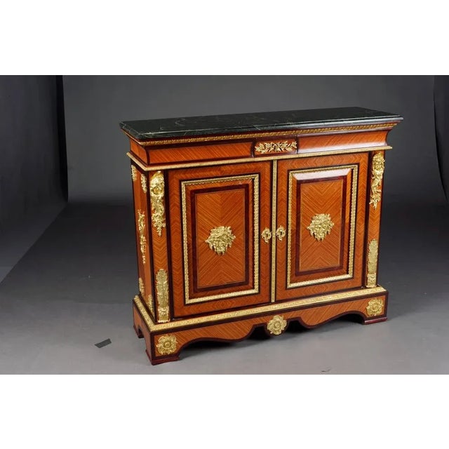 20th Century Louis XIV style chest of drawers / sideboard solid beech wood. The fittings are pronounced and of...