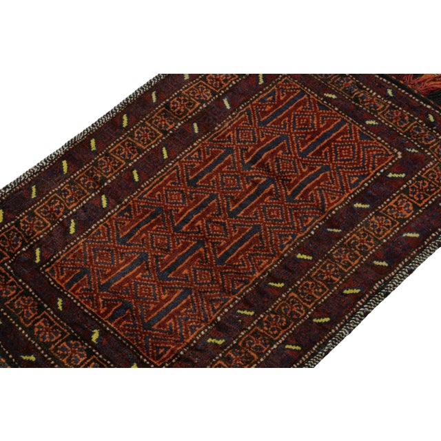 Hand knotted in wool, this 2x3 Baluch scatter rug represents a new line of tribal carpets in the Modern Classics...