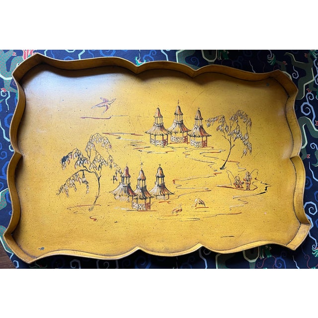 Elegant vintage collapsible butler’s tray table featuring a beautifully painted Chinoiserie landscape with pagodas, birds,...