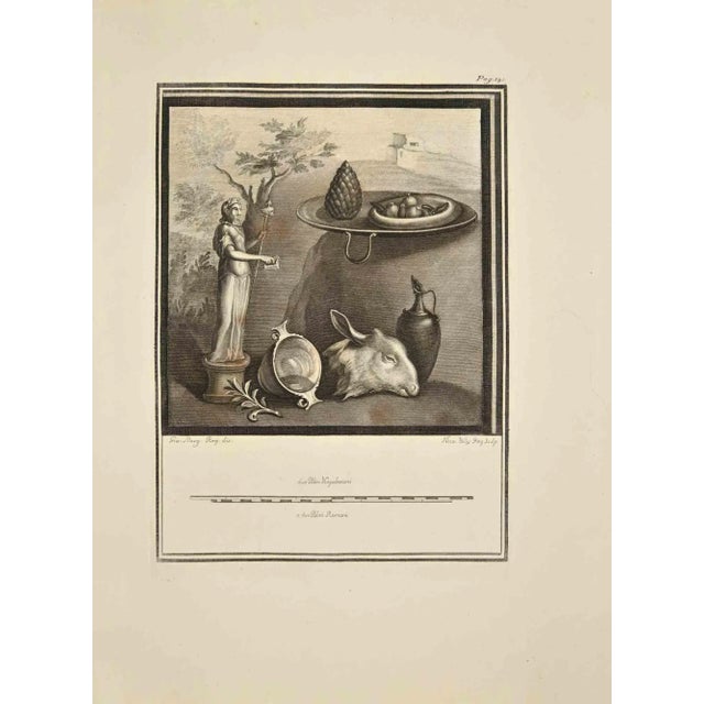 The Statue Of Bacchus with Devotional Offering from "Antiquities of Herculaneum" is an etching on paper realized by Nicola...