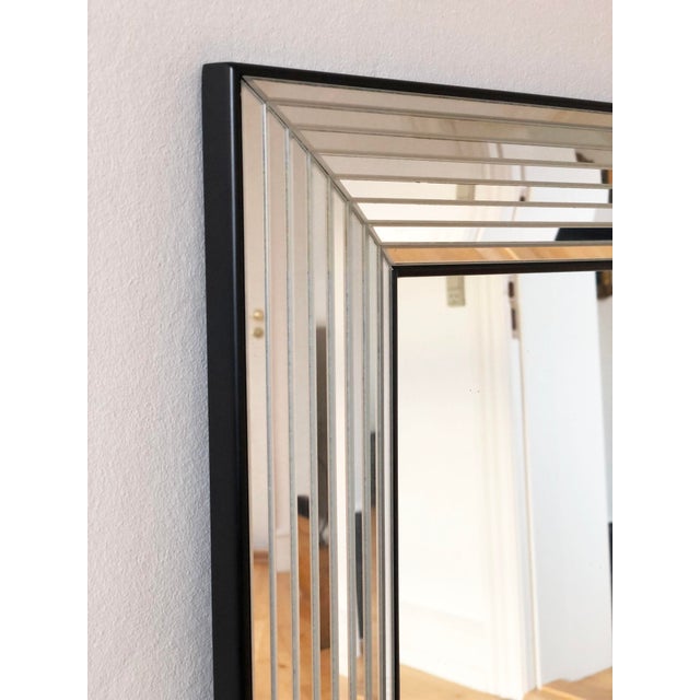 Large rectangular mirror by Deknudt, made in Belgium in the 1980s. The mirror has beveled glass panels in a layered frame...