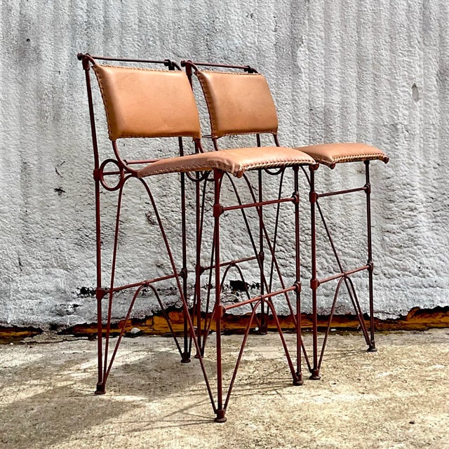 A fabulous pair of vintage bar stool done in the manner of Ilana Goor. The bar stools are in a brutalist style with bent...