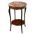 Dimensions: 28 ¾” H x 18 ¾” W x 18 ¾” D A petite French occasional table from the 19th century made of rosewood with...