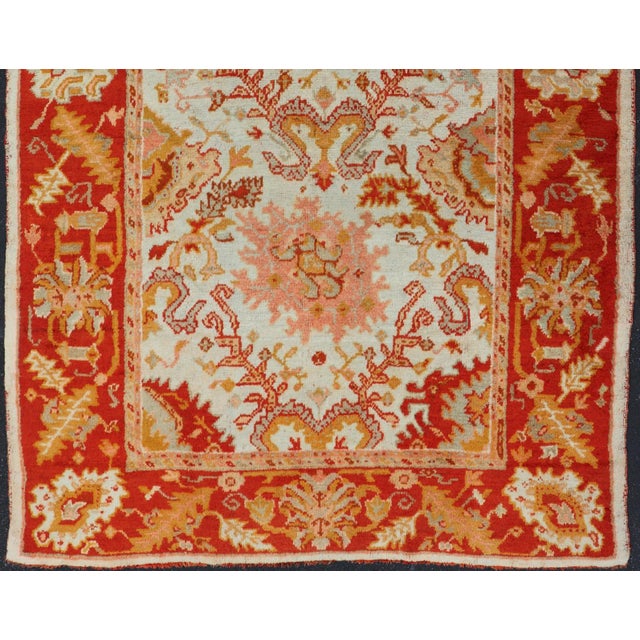 Tribal Antique Turkish Oushak With Elegant Motifs in Red, Ivory, Gold and Salmon Pink 7 X 9'8 For Sale - Image 3 of 15