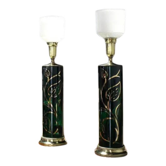 Pair of very nice emerald green glass table lamps on brass bases.