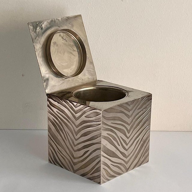 This elegant and bold cube-shaped ice bucket is a perfect example of the bold, textured design of the 1970s. Crafted in...