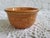 An orange oven safe ramekin, marked 'Made in USA'. It measures 3 3/4" diameter x 2" h x 2 1/4" base. This would make a...