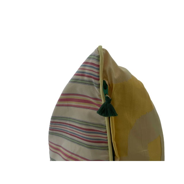 Yellow silk facing with striped pink/green/maroon and tan backing. Includes Michelle Workman signature zipper with pompon...