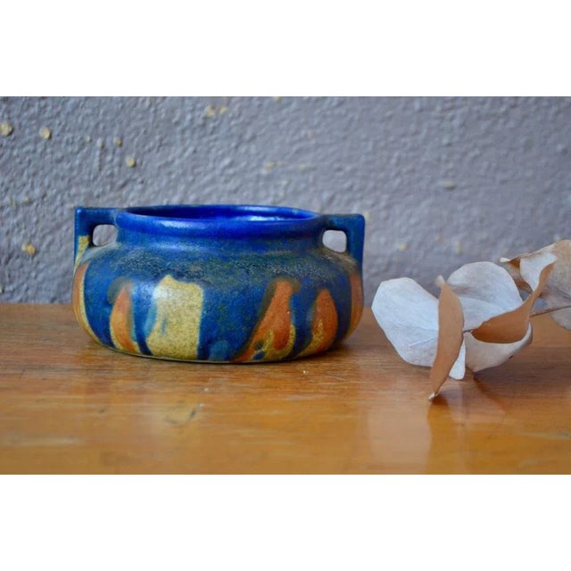 This pretty pot with ceramic handles signed Bardelais is an Art Nouveau production. The blue drip enamel on a sand...