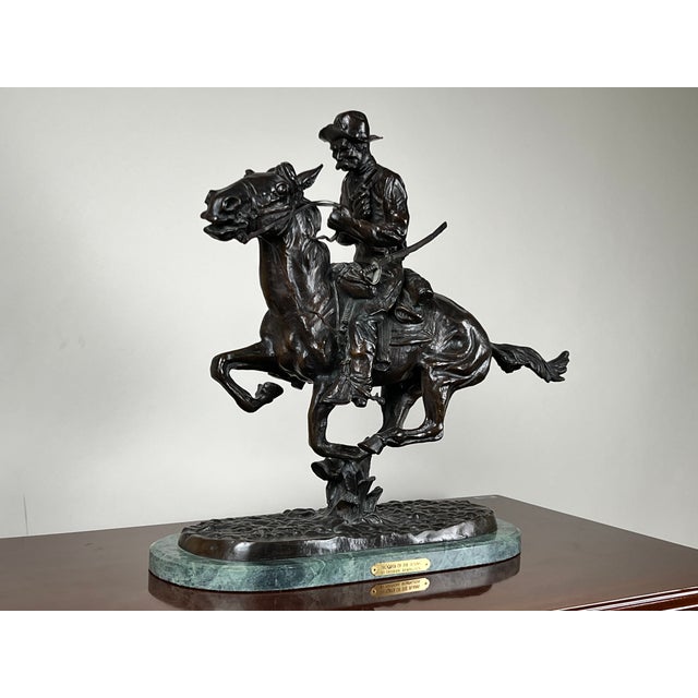This dynamic bronze sculpture after Frederick Remington’s celebrated Trooper of the Plains captures the drama and movement...