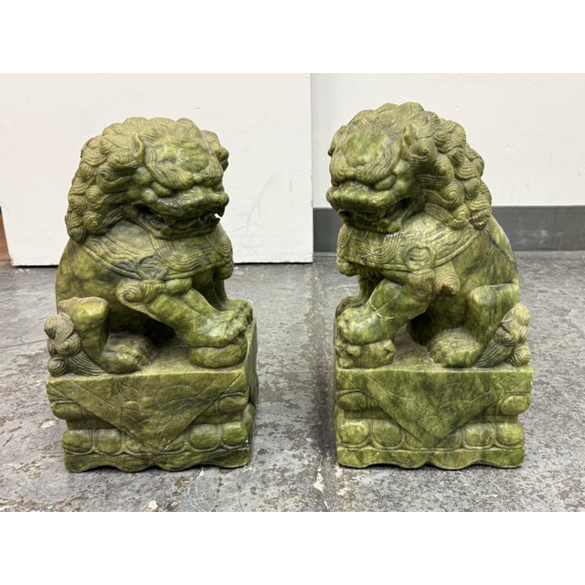 Design Plus Gallery presents a Pair of Jade Guardians Lions. This pair of stunning carved Jade guardian lions stand on...