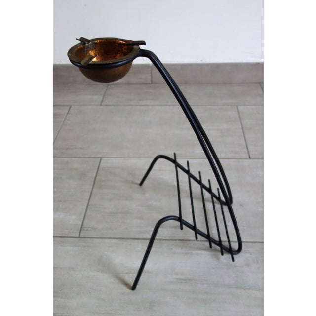 1950s French design metal magazine and ashtray rack. The ashtray is removable and can be replaced with a plant, for...