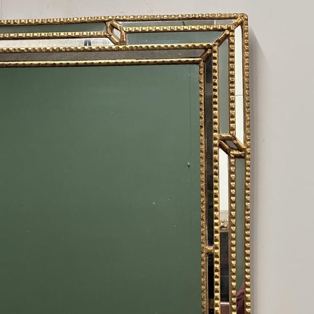 Height 137 cm x Width 97 cm. This impressive large-scale Italian mirror dates from the 1980s and features an elegant gilt...