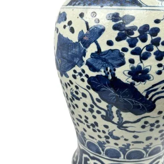 This graceful porcelain jar is embellished with an overall design of fish and flower -- a common, yet popular motif in...
