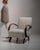 Bentwood-arm lounge chair in Warm Ivory Boucle. Finished in warm ivory boucle, this bentwood-arm lounge chair is...