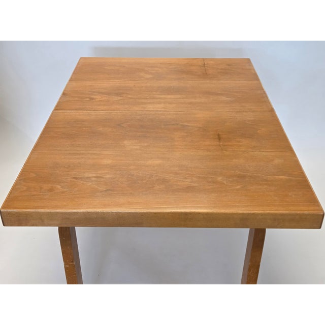 Artek 92 extendable table with two extension pieces. Birch frame, hardwood veneer on the surface. Designer Alvar Aalto....