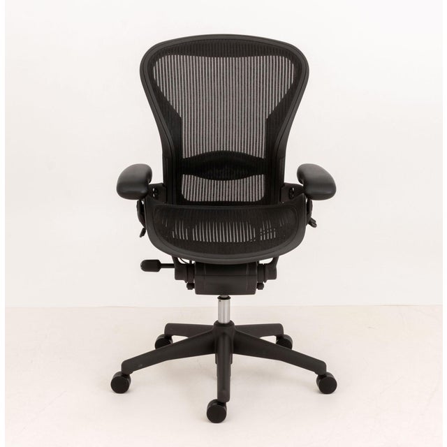 Herman Miller "Aeron" Office Chair, with swivel seat, adjustable seat, back, and arms on five star base on casters, marked...