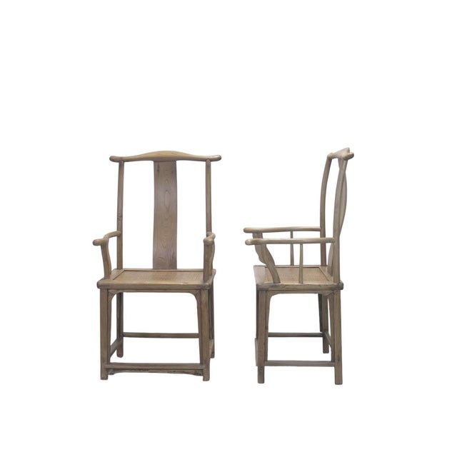 This 19th century pair of armchairs are classic examples of the Official's Hat (guānmàoyǐ) style. Made from solid elm,...