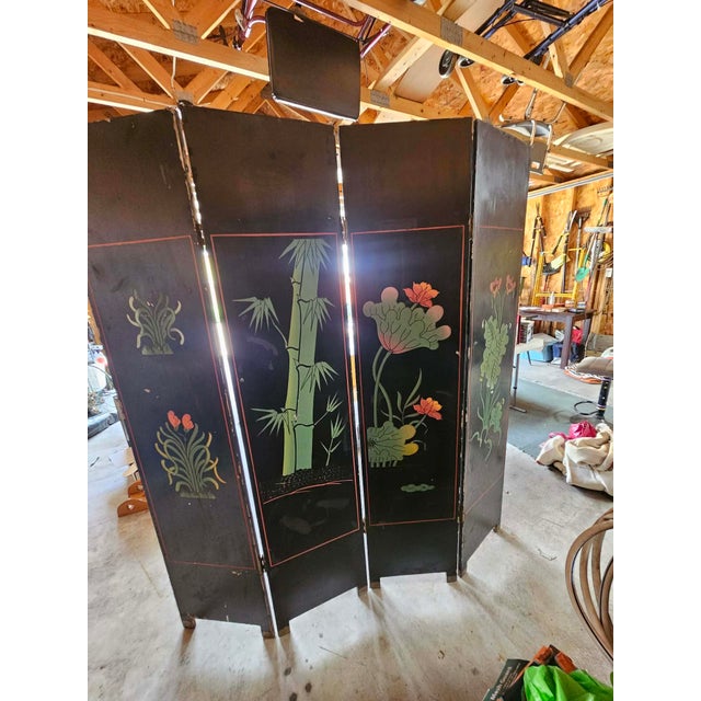 This spectacular vintage Chinese export is an incised, hand-painted Coromandel Screen which depicts pink crowned cranes....