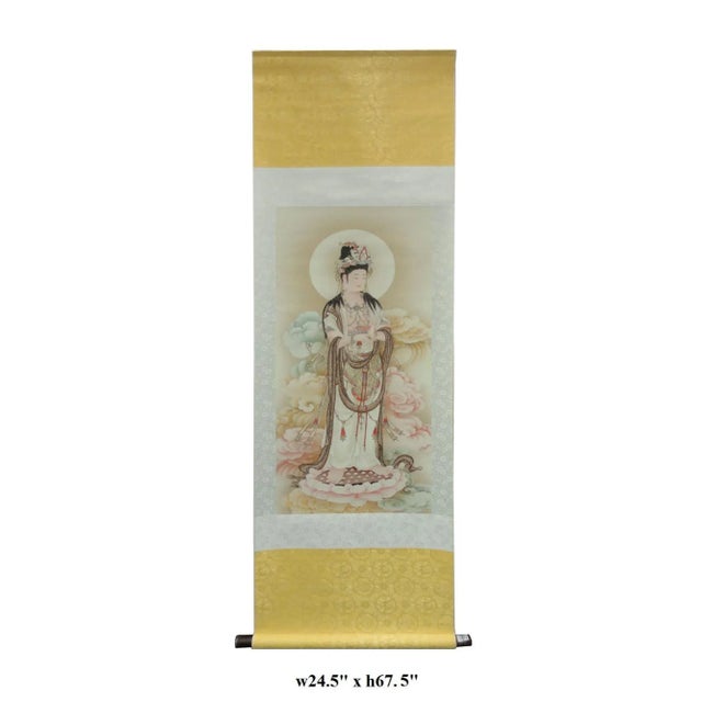 This is a Chinese hand painted lotus Kwan Yin motif scroll. In this painting, Kwan Yin is standing on a lotus stand and in...
