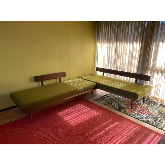 Mid Century modern daybed set. Frames are made of solid hardwood (possibly walnut) and metal. One daybed has wheels to...