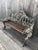 An exceptional original Coalbrookdale cast iron garden bench in the celebrated Gothic Revival pattern, retaining its...