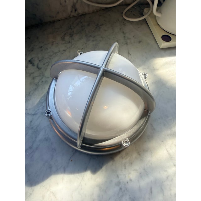 Design Studio looking to rehouse (1) Louis Poulsen Skot Outdoor Wall Light as a part of a restoration project in the...