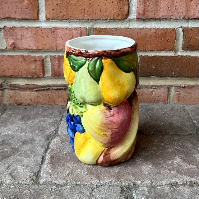 Vintage Italian majolica vase featuring 3D relief fruit - grapes, orange, lemon, banana and pear to name a few. Full of...