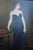 Beautiful antique 20th century oil painting of a woman holding her black dress while holding a French Roll Top Desk Louis...
