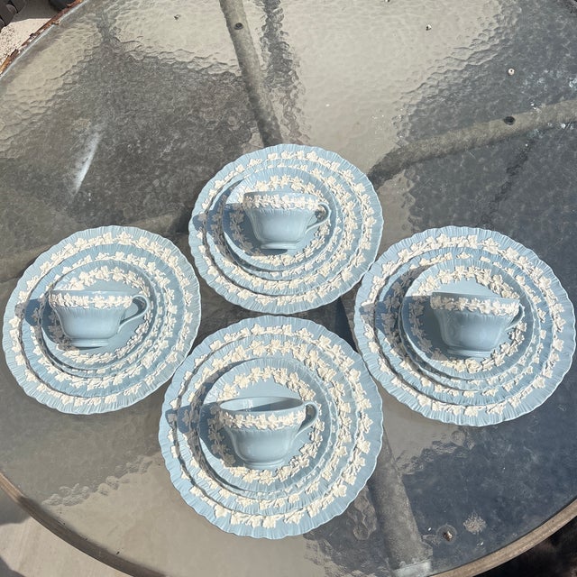 Wedgwood Queensware 20 piece place service for 4. This is a beautiful set of dishes that has a light blue body which...