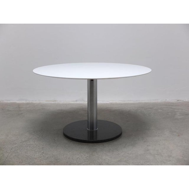Round dining table designed by Alfred Hendrickx for Belform circa 1960. This model comes with a white laminated wooden top...