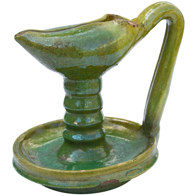 Antique handcrafted and glazed Moroccan green ceramic oil lamp with handle, featuring an elaborate silhouette and ornate...