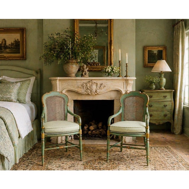 Elegant pair of vintage Italian Neoclassical armchairs featuring hand-woven cane backs and delicately turned legs with...