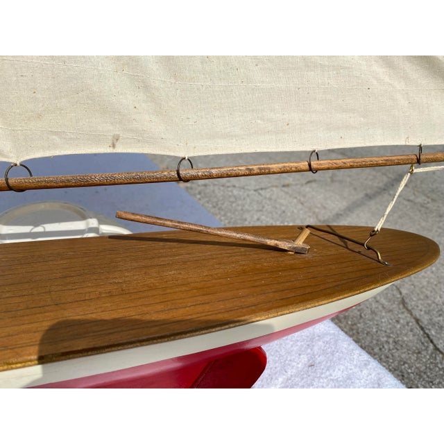 This is a wonderful model sailboat! The sails can be adjusted and have tiny hooks which can be attached to the masts. The...