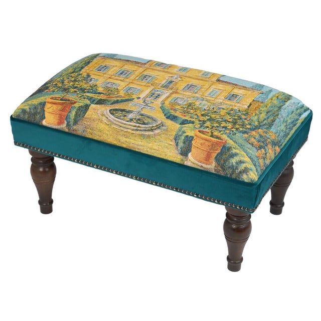 Meticulously handcrafted in the United Kingdom, this upholstered stool boasts classic studding and hand-polished solid...