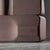 Pink sandstone sculpture created by Robert Neuhauser in Switzerland, circa mid-1980s. The piece develops a compact volume...