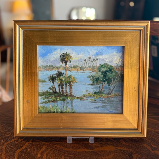 Framed oil on board landscape painting of Florida swamp with palms signed "Bozarth." Frame measures 15.25"W x 13.25"H x...