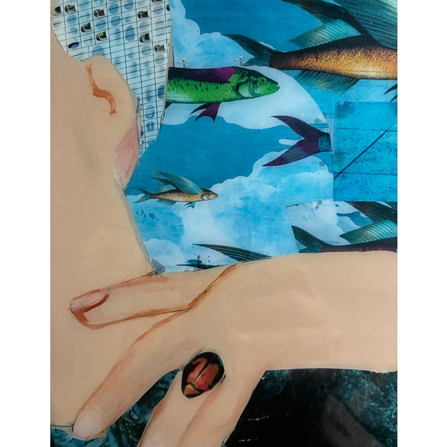 Portrait of a thoughtful model/mermaid (?) with colorful fish flowing around her, an original mixed media collage with...