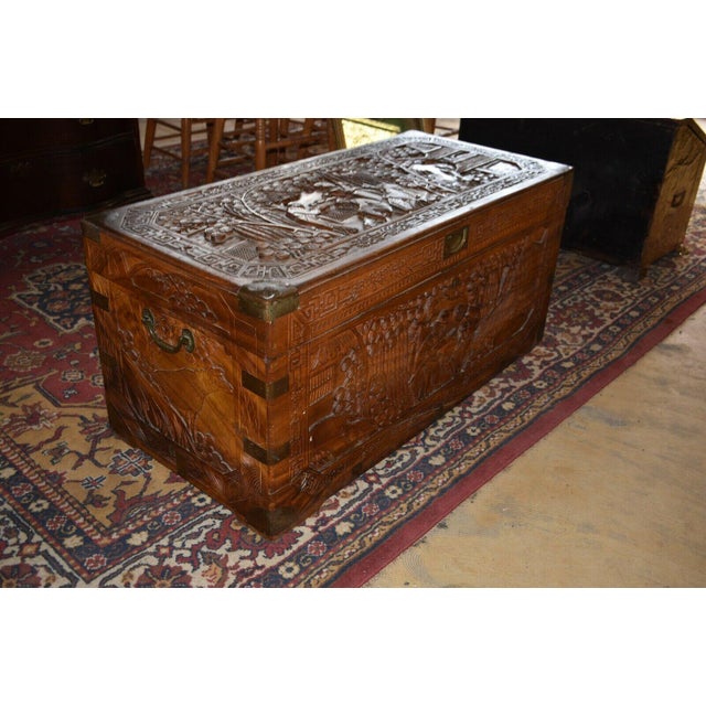 Beautiful Carved Camphor Chest, Heavily Carved Well made solid piece. Very nice Brass corners and side handles. Dark color...