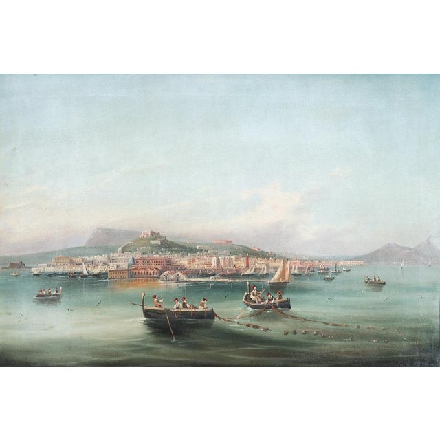 An antique oil-on-canvas painting with a period frame depicting a view of the Gulf of Naples, dating from the second half...