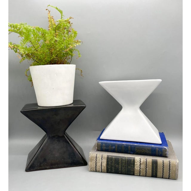 Unique and charming pair of black and white pedestal stands. Made in the mid-late 20th century out of terra cotta....