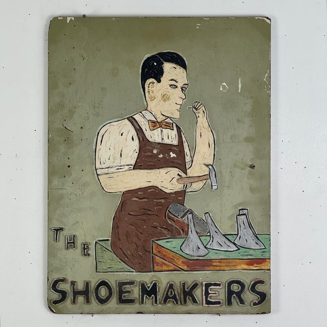 A rarity in the category of trade signs, a unique hand painted 1920s shop advertisement for shoe making. It features a...