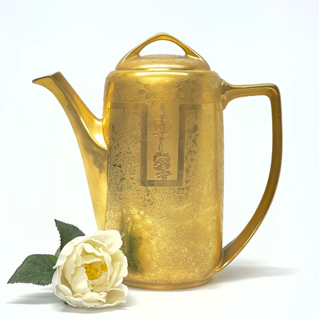 Gold ceramic coffee pot. This is a vintage, stunning, gold embellished porcelain coffee pot with floral details by Nara...